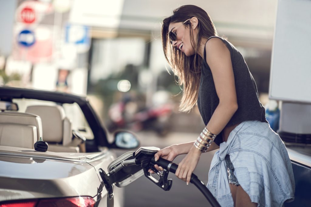 Woman filling up car with the wrong fuel